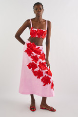 Profile view of model wearing the Oroton Contrast 3D Flower A-Line Skirt in Rose/Poppy and 100% linen for Women