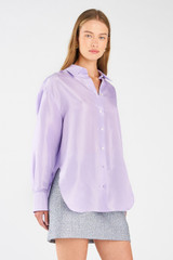 Profile view of model wearing the Oroton Silk Long Sleeve Shirt in Lilac and 100% silk for Women