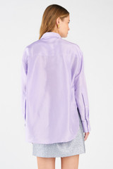 Profile view of model wearing the Oroton Silk Long Sleeve Shirt in Lilac and 100% silk for Women