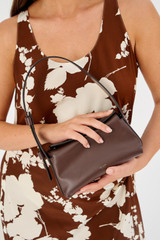 Profile view of model wearing the Oroton Caroline Small Day Bag in Bear Brown and Smooth leather for Women