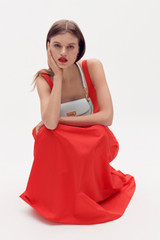 Profile view of model wearing the Oroton Tie Back Sundress in Poppy and 100% cotton for Women .