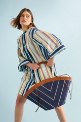 Profile view of model wearing the Oroton Boathouse Stripe Dress in Multi and 100% cotton for Women