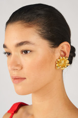 Profile view of model wearing the Oroton Peony Earrings in Worn Gold and Brass for Women