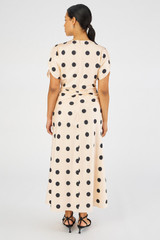 Profile view of model wearing the Oroton Large Spot Print Dress in Soft Peach and 100% Silk for Women