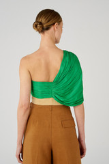 Profile view of model wearing the Oroton Blocked Drape Bodice in Jewel Green and 77% cotton, 23% linen & 100% recycled polyester for Women