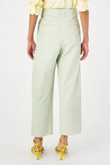 Profile view of model wearing the Oroton Twill Pleat Pant in Eau De Nil and 77% cotton 23% linen for Women