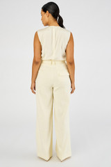 Profile view of model wearing the Oroton Pleat Pant in Lemon Curd and 81% viscose, 17% cotton, 2% elastane for Women