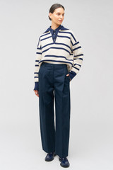 Profile view of model wearing the Oroton Twill Pleat Pant in North Sea and 77% cotton 23% linen for Women