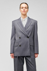 Profile view of model wearing the Oroton Man Style Blazer in Dark Ash and 50% wool, 50% recycled polyester for Women .