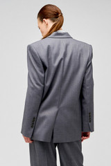 Profile view of model wearing the Oroton Man Style Blazer in Dark Ash and 50% wool, 50% recycled polyester for Women .