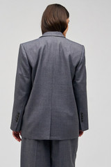 Profile view of model wearing the Oroton Man Style Blazer in Dark Ash and 50% wool, 50% recycled polyester for Women .