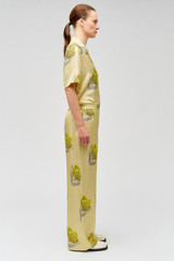 Profile view of model wearing the Oroton Linear Tulip Pj Pant in Fennel and 100% silk for Women