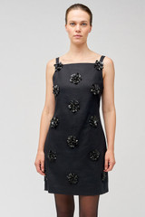 Profile view of model wearing the Oroton Flower Sequin Shift Dress in Black and 100% linen for Women