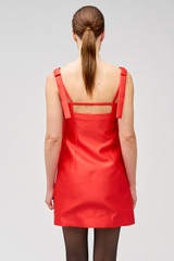 Profile view of model wearing the Oroton Satin Mini Dress in Poppy and 85% polyester, 15% silk for Women .