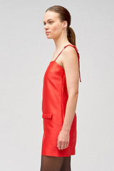 Profile view of model wearing the Oroton Satin Mini Dress in Poppy and 85% polyester, 15% silk for Women .