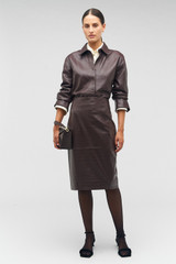 Profile view of model wearing the Oroton Embossed Croc Long Sleeve Overshirt in Burgundy and 100% leather for Women .