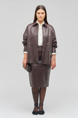 Profile view of model wearing the Oroton Embossed Croc Long Sleeve Overshirt in Burgundy and 100% leather for Women .
