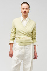 Profile view of model wearing the Oroton Wrap Cardigan in Fennel and 100% merino wool for Women