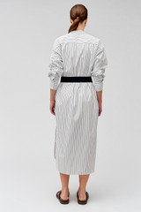 Profile view of model wearing the Oroton Pinstripe Shirt Dress in White and 100% cotton for Women