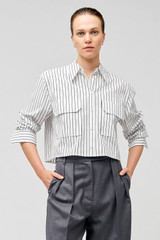 Profile view of model wearing the Oroton Pinstripe Cropped Shirt in White and 100% cotton for Women