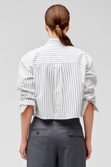 Profile view of model wearing the Oroton Pinstripe Cropped Shirt in White and 100% cotton for Women