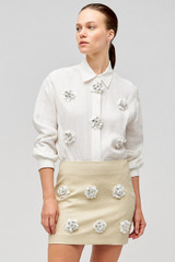 Profile view of model wearing the Oroton Flower Sequin Overshirt in Antique White and 100% linen for Women