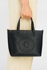 Profile view of model wearing the Oroton Polly Small Tote in Black and Pebble Leather for Women . IP:3