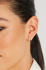 Profile view of model wearing the Oroton Leah Stud Earrings in Gold and Stainless Steel for Women