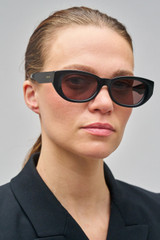 Profile view of model wearing the Oroton Nadja Sunglasses in Black and Bio acetate (Biodegradeable) for Women