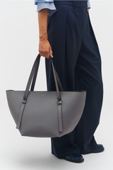 Profile view of model wearing the Oroton Ellis Medium Tote in Grey Flannel and Pebble leather for Women