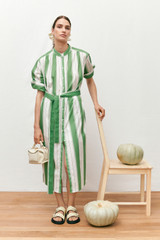 Profile view of model wearing the Oroton Deckchair Stripe Shirt Dress in Clover and 100% cotton for Women