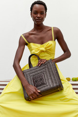 Profile view of model wearing the Oroton Lace Trim Sundress in Vibrant Yellow and 100% cotton for Women .
