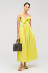 Profile view of model wearing the Oroton Lace Trim Sundress in Vibrant Yellow and 100% cotton for Women .