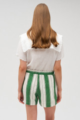 Profile view of model wearing the Oroton Deckchair Stripe Short in Clover and 100% linen for Women