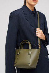 Profile view of model wearing the Oroton Ellis Small Tote in Pine Needle and Smooth leather for Women