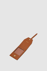 Internal product shot of the Oroton Fife Luggage Tag in Amber and Pebble leather material for Women .