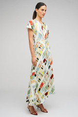 Profile view of model wearing the Oroton Vintage Ribbon Print Dress in Multi and 100% silk fabric for Women .