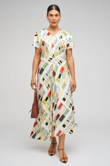 Profile view of model wearing the Oroton Vintage Ribbon Print Dress in Multi and 100% silk fabric for Women .