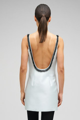 Profile view of model wearing the Oroton Embellished Mini Dress in Pale Blue and 85% Polyester 15% Silk for Women .