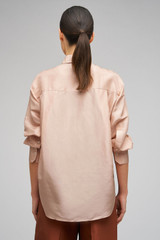 Profile view of model wearing the Oroton Ls Silk Shirt in Pale Rosewood and 100% Silk for Women