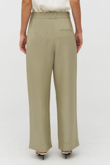Profile view of model wearing the Oroton Pleat Pant in Laurel and 58% Viscose 42% Linen for Women . IP:6