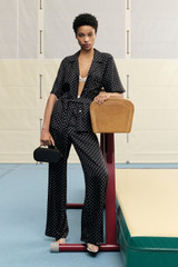 Profile view of model wearing the Oroton Spot Print Pj Pant in Black/Cream and 100% Silk for Women