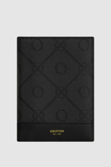 Front product shot of the Oroton Harvey Signature Passport Cover in Black and Nylon canvas base cloth material with PVC coating (70% PVC, 30% polyester) for Women .