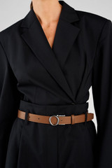 Profile view of model wearing the Oroton Ali Reversible Belt in Silver-Tan/Cream and Premium smooth leather for Women .