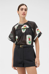 Profile view of model wearing the Oroton Alfie Carpenter Short in Washed Black and Crafted from cotton twill  for Women .