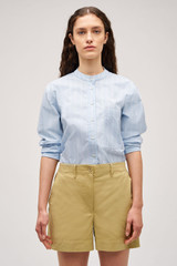 Profile view of model wearing the Oroton Alfie Carpenter Short in Wheat and Crafted from cotton twill  for Women .