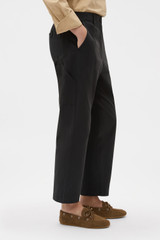 Profile view of model wearing the Oroton Arlo Carpenter Chino in Washed Black and 100% cotton fabric for Women .