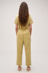 Profile view of model wearing the Oroton Arlo Carpenter Chino in Wheat and 100% cotton fabric for Women .