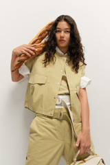 Profile view of model wearing the Oroton Cotton Twill Vest in Wheat and  for Women .