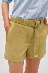 Profile view of model wearing the Oroton Quinn Webbing Belt in Wheat and 100% cotton material for Women .